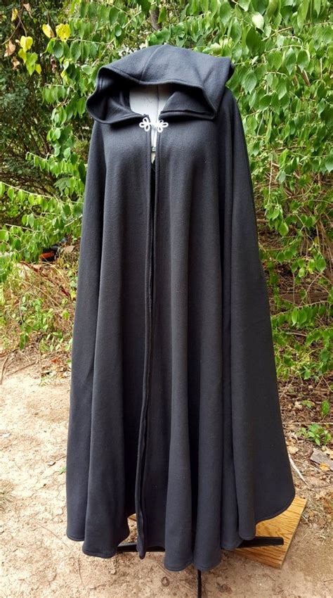 The bottom edge of the hood should be a perfect fit for the top edge of the cloak. . Long black cloak